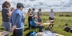 People watching an art demonstration on Cleeve Hill