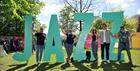 Guests stood with JAZZ sign.