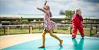 Two girls playing at Cotswold Farm Park
