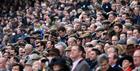 Crowds watching the action at Cheltenham Racecourse