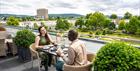 A couple enjoying afternoon Tea on the Nook on Five terrace