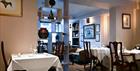 Interior tables and chairs at East India Cafe
