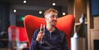 Man enjoying drink in lounge area at Holiday Inn Express