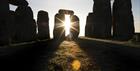 The sun shining at Stonehenge