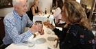 A couple raising a toast at East India Cafe Cheltenham