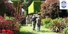 Visitors strolling through gardens