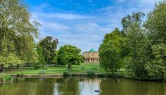 Pittville Pump Room Cheltenham across the lake