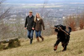 Walkers and dog up Leckhampton Hill