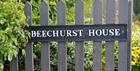 Beechurst House sign on fence