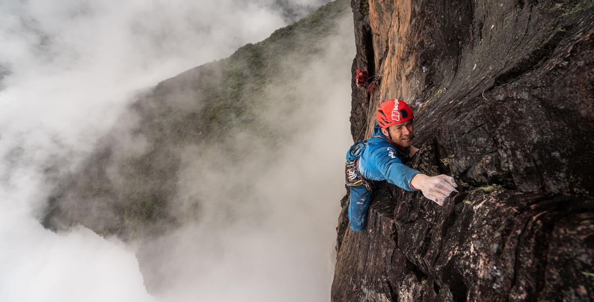 Leo Houlding, high up, climbing a sheer rock wall