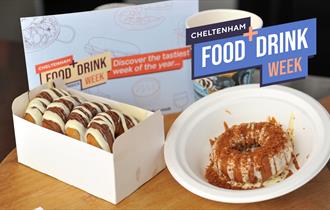 Donuts and a hot drink with Food + Drink week leaflet