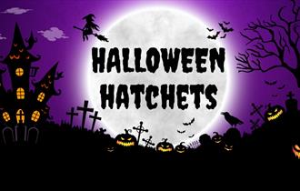Halloween Hatchets headline written in front of large moon with various Halloween items around it