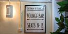 Cheltenham Playhouse lounge bar and seats signage