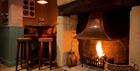 A burning fireplace in the Kings Arms Prestbury