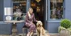 Outside of Regency Chandeliers & Interiors, owner and her dog