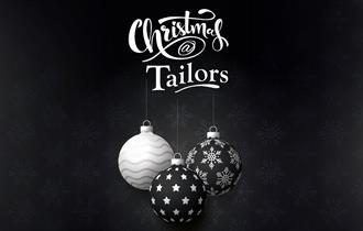 A black and white graphic of Christmas baubles