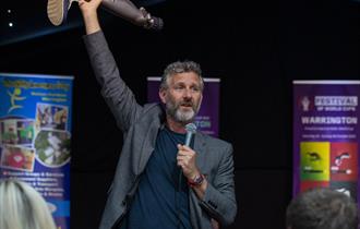Adam Hills at the PDRL Comedy and Curry Fundraiser. Credit Joe Richardson, Warrington Wolves
