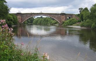 A view of Grosvenor Bridge from the Handbridge River Bank. Photo credit: John S. Turner