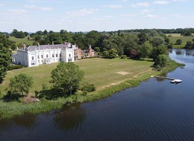 Aerial shot of Combermere Abbey with the mere