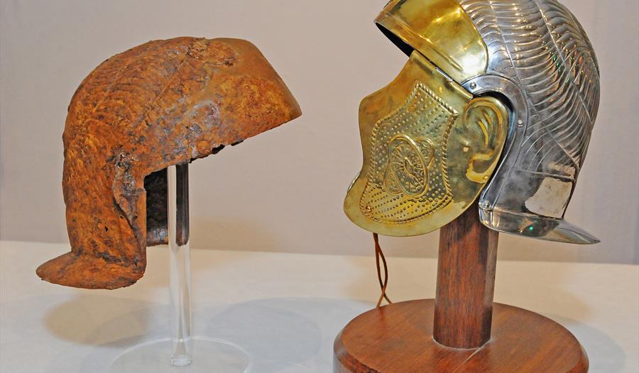 Original and replica of the Roman Auxiliary Cavalry Helmet discovered in Northwich and on display at Weaver Hall