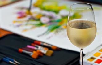 Wine glass and paints
