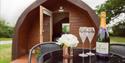 Champagne outside glamping pod at Pitch & Canvas