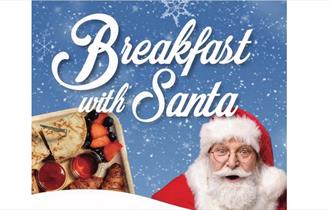 Breakfast with Santa text, with image of image of Santa and breakfast platter.
