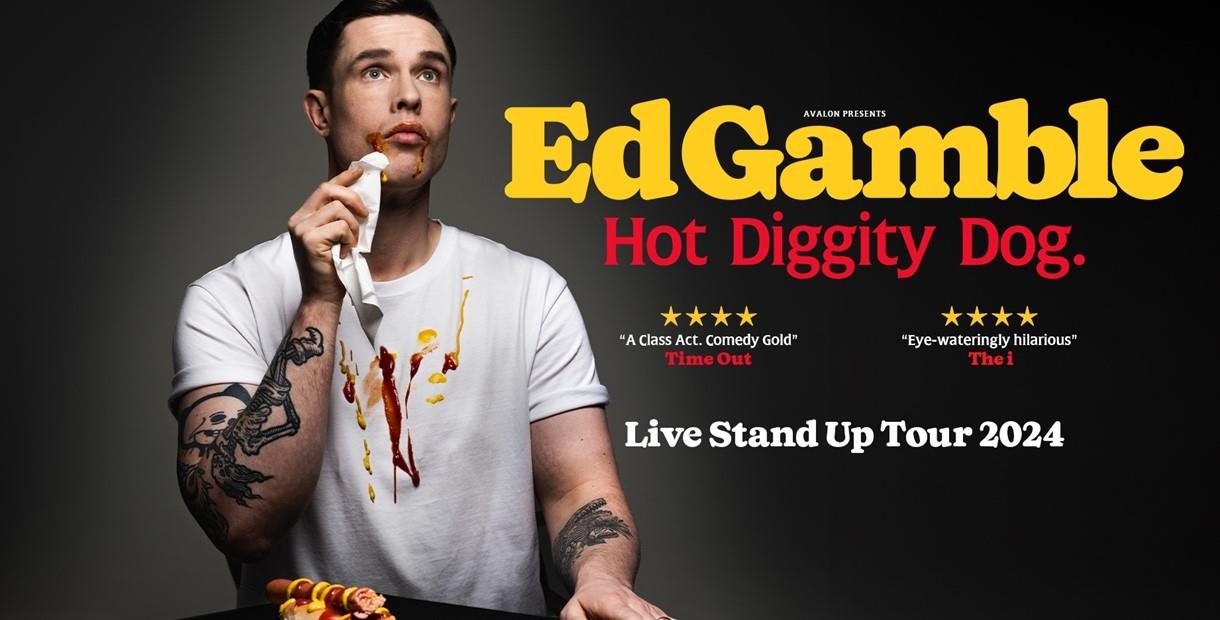 Ed Gamble wiping hot dog sauces off his face with a napkin