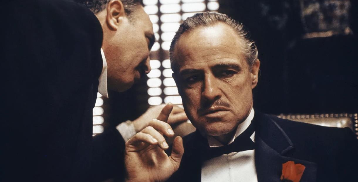 Marlon Brando and Al Pacino as Vito and Michael Corleone