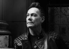 Black and white portrait of Craig Revel Horwood