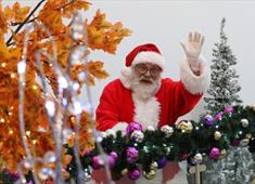 Father Christmas waving at the camera