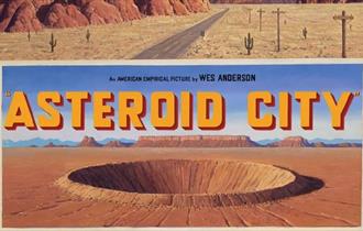 Road sign for Asteroid City with a crater image in the desert floor