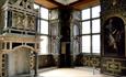 Intricate dark furniture and fireplace in Bolsover Castle