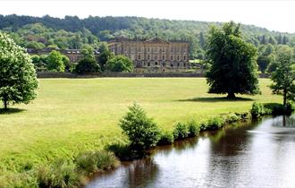 River through Chatsworth Gardens with the house in the background