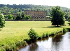 River through Chatsworth Gardens with the house in the background