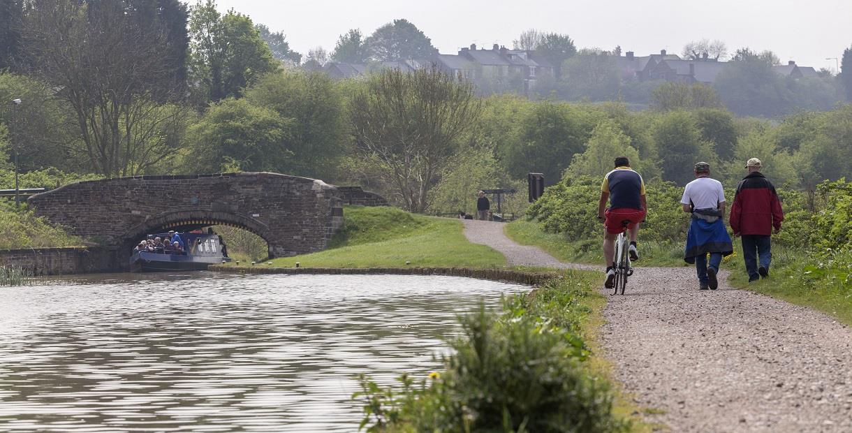 Walkers and cyclists on Chesterfield canal footpath
