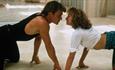 Patrick Swayze and Jennifer Grey on their hands and knees dancing in Dirty Dancing