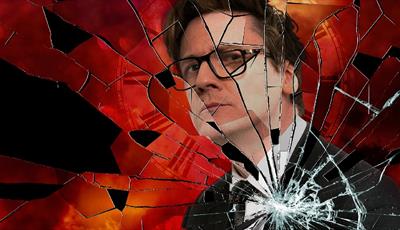 Ed Byrne behind a shattered piece of glass