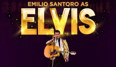 Emilio Santoro dressed as Elvis singing into a mic