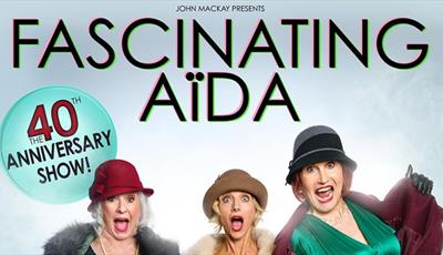 Three women of Fascinating Aida in vintage hats and coats