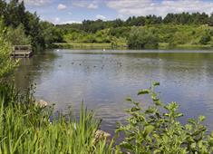 A photo of the lake at Holmewood Valley Park