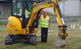 Young girl playing a game on a JCB digger
