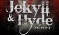 Jekyll and Hyde written in worn looking white writing on a black and red blurred background.