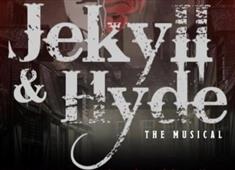 Jekyll and Hyde written in worn looking white writing on a black and red blurred background.