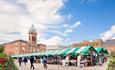 Busy market stalls outside Chesterfield Market Hall