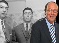 A black and white image of Ronnie and Reggie Kray stood side by side in suits looking at the camera with a colour picture of Fred Dinenage to the righ