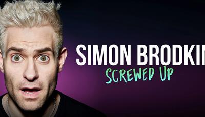 Comedian Simon Brodkin pulling a surprised face with his name in text next to him
