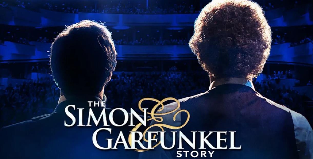 The backs of two heads looking out from a stage into an auditorium, with the text The Simon and Garfunkel Story