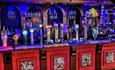 Inside of The County Bar - a colourful bar with lots of beers on draft.