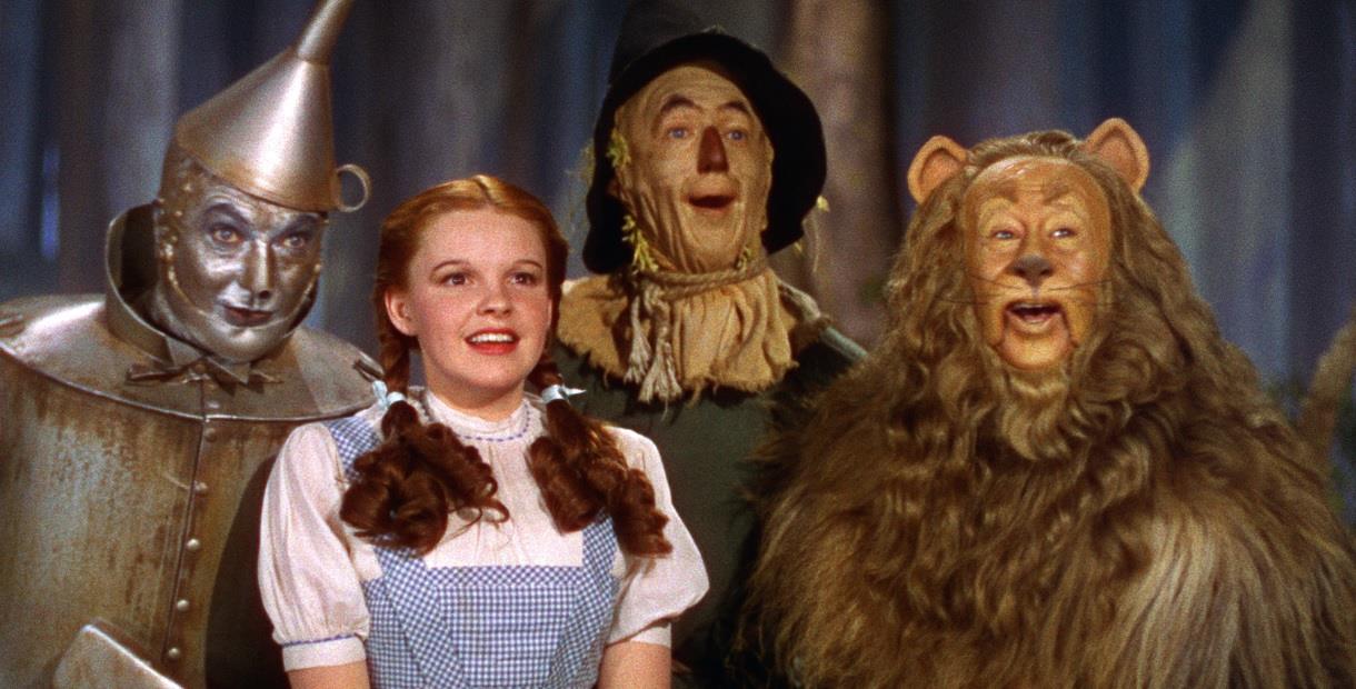Tin Man, Dorothy, Scarecrow and the Cowardly Lion all smiling